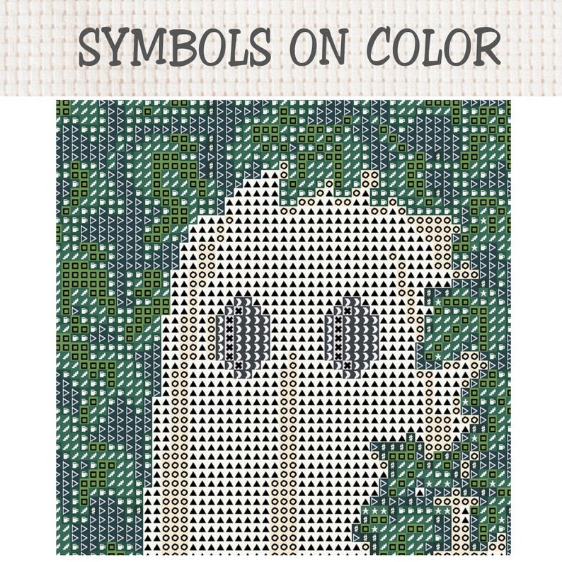 May include: A cross stitch pattern chart titled SYMBOLS ON COLOR featuring a grid of geometric symbols. The design displays a central white ghost-like figure composed of black triangles and circles against a dark green background of squares.