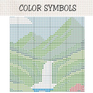 Pu&ograve; includere: Uno schema per punto croce intitolato COLOR SYMBOLS che presenta una griglia con varie icone, tra cui cuori verdi, alberi blu e piccoli quadrati. Il disegno raffigura un paesaggio con un'area bianca centrale e accenti rossi sul fondo.