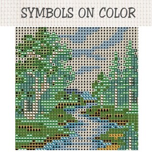 May include: A cross stitch pattern chart titled SYMBOLS ON COLOR featuring a grid of squares filled with various geometric icons, stars, trees, and hearts in shades of green, blue, black, and white to guide embroidery thread placement.