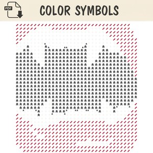 Op de afbeelding: Een digitaal kruissteekpatroon getiteld COLOR SYMBOLS met een centrale vleermuissilhouet bestaande uit zwarte chevron-symbolen op een wit raster, met rode schuine strepen in de vier hoeken van het vierkante ontwerp.