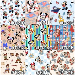 May include: A collection of fabric patterns featuring various Disney characters. Designs include Mickey Mouse in sailor attire, nautical themes with anchors and ships, and pirate-themed patterns. Each pattern has a unique color scheme and character arrangement.