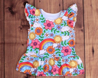 Top peplum floral arcoíris: Camisa de manga con volantes para bebé y niña pequeña