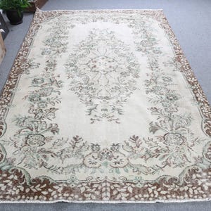 Vintage Turkish Area Rug, Elegant Floral Design, Soft Neutral Tones, 5x9ft, Handmade Carpet, Traditional Home Decor, Unique Craftsmanship
