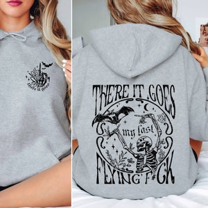 There It Goes My Last Flying F*ck Hoodie, Sarcastic Skeleton Hoodie, Skeleton Funny Bat Hoodie, Woman Skeleton Hand Hoodie Matching