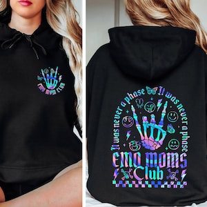 May include: Black hoodie with a rainbow holographic design featuring a skeleton hand with the text "It was never a phase Emo Moms Club" on the back.
