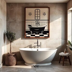 May include: A white freestanding bathtub with a chrome faucet in a bathroom with a framed black and white illustration of a bathtub with a checkered floor and a window above it. The bathroom has a brown towel hanging on a hook, a potted olive tree, and a wooden stool with a rolled towel on top.