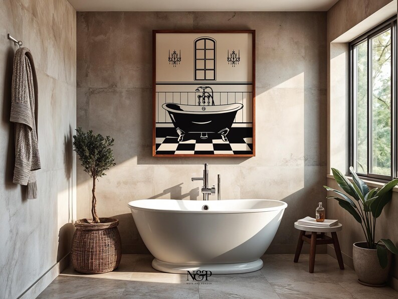 May include: A white freestanding bathtub with a chrome faucet in a bathroom with a framed black and white illustration of a bathtub with a checkered floor and a window above it. The bathroom has a brown towel hanging on a hook, a potted olive tree, and a wooden stool with a rolled towel on top.