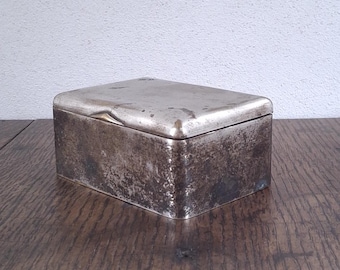 Antique simple distressed small metal box with a wooden lining and a hinged lid
