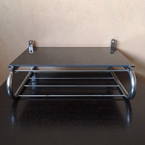 Unique vintage metal chromed functionalist rod shelf with removable black glass plate