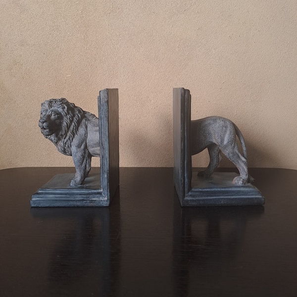 A pair of plaster lion book-ends