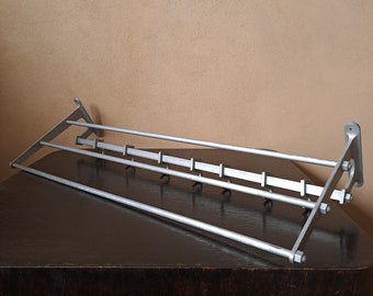 Vintage Art Nouveau cast aluminum rod shelf with seven hooks