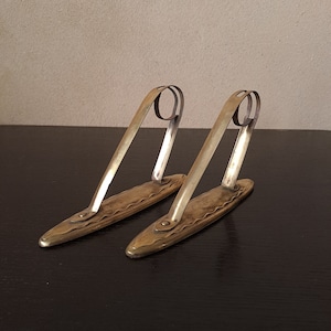 One pair of delicate Art Nouveau/Secession bronze-colored curtain rod holders
