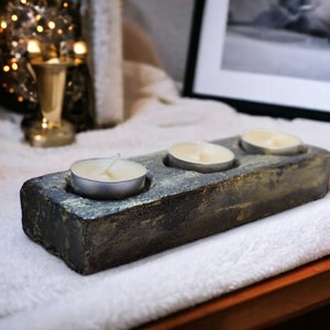 Tealight holder made of concrete, color: black with gold. Handmade as a unique piece.