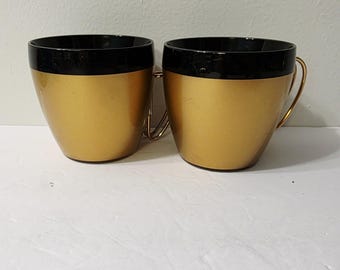 2 tazze da caffè vintage anni '60 Thermo Serv con bordo nero e manico dorato, stile MCM Atomic Regency