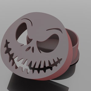 May include: A 3D printed, open lidded box with a Jack Skellington face design. The box is a light brown color.