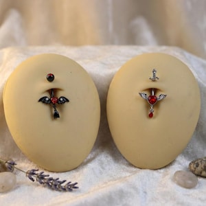 May include: A white ceramic mug with a black handle and the text "But First, Coffee" in a black, bold font. The mug is on a white surface. The mug is approximately 4 inches tall.