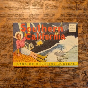 May include: A vintage postcard featuring the text Southern California Land of Colorful Contrast. The illustration depicts a person in a pink shirt, white skirt, and yellow boots sitting on a pile of oranges next to a crashing ocean wave.