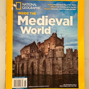 May include: A National Geographic magazine titled Inside the Medieval World with a bright yellow border. The cover features a large stone castle, identified as Gravensteen in Ghent, Belgium, under a cloudy sky. Text includes Explore the Changing Map of the World, Glimpse the Defining Art of the Era, and Discover Influential Cities Through the Ages.