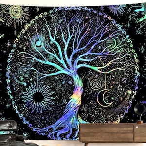May include: Black tapestry featuring a colourful tree of life design. The tree has a rainbow trunk and branches, surrounded by celestial elements such as suns, moons, and stars. The background is a dark, starry night.