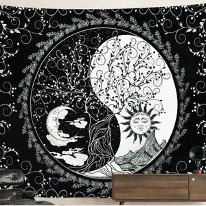 May include: Black and white tapestry featuring a Yin and Yang design with a tree, sun, and moon. The tapestry has a circular design with a detailed illustration of a tree, sun, and moon. The background is black with white floral patterns.
