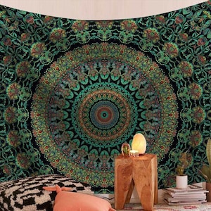 May include: A large, ornate tapestry with a central mandala design. The tapestry features a complex pattern in shades of green, teal, and orange against a black background. The design is symmetrical and detailed, creating a visually striking piece of wall art.
