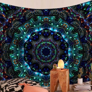 May include: A vibrant tapestry with a complex, symmetrical design in shades of blue, green, and orange. The central motif is a circular pattern with geometric shapes, creating a psychedelic effect. The tapestry is likely used as wall decor.