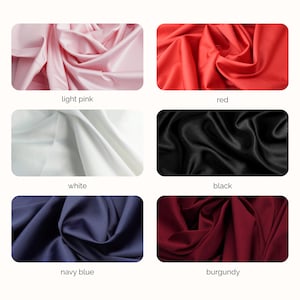 May include: A collection of six fabric swatches arranged in a grid, featuring smooth, draped material in light pink, red, white, black, navy blue, and burgundy. Each colour block is labelled with its corresponding name in black text below the swatch.