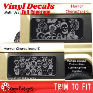 May include: Black vinyl decals featuring a collage of horror movie characters applied to the side windows of a vehicle. The designs include iconic figures such as masked killers and supernatural entities in a repeating pattern. Text includes Vinyl Decals, Multi Use Full Coverage, Horror Characters-1, Horror Charactoers-2, Multiple Designs, Various Sizes, Custom Options available, Design Credit @dcprintsnv, and TRIM TO FIT.