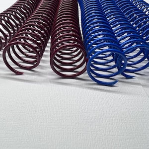 May include: Two sets of metal binding coils, one set is dark red and the other is blue. The coils are lying on a white surface.