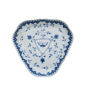 May include: A white, triangular-shaped serving dish with a blue floral and butterfly design. The rim has a scalloped edge with a repeating blue pattern. The center features a blue butterfly within a triangle.