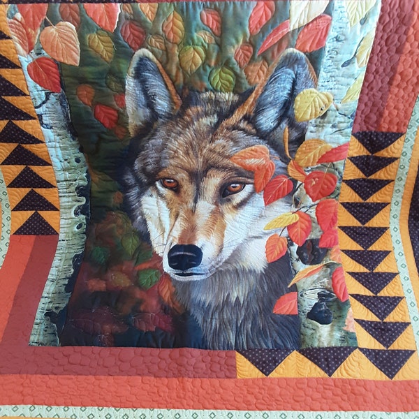 Handcrafted Wolf wall hanging or quilt which measures approximately 68 by 60 inches and is made of cotton fabric and cotton batting