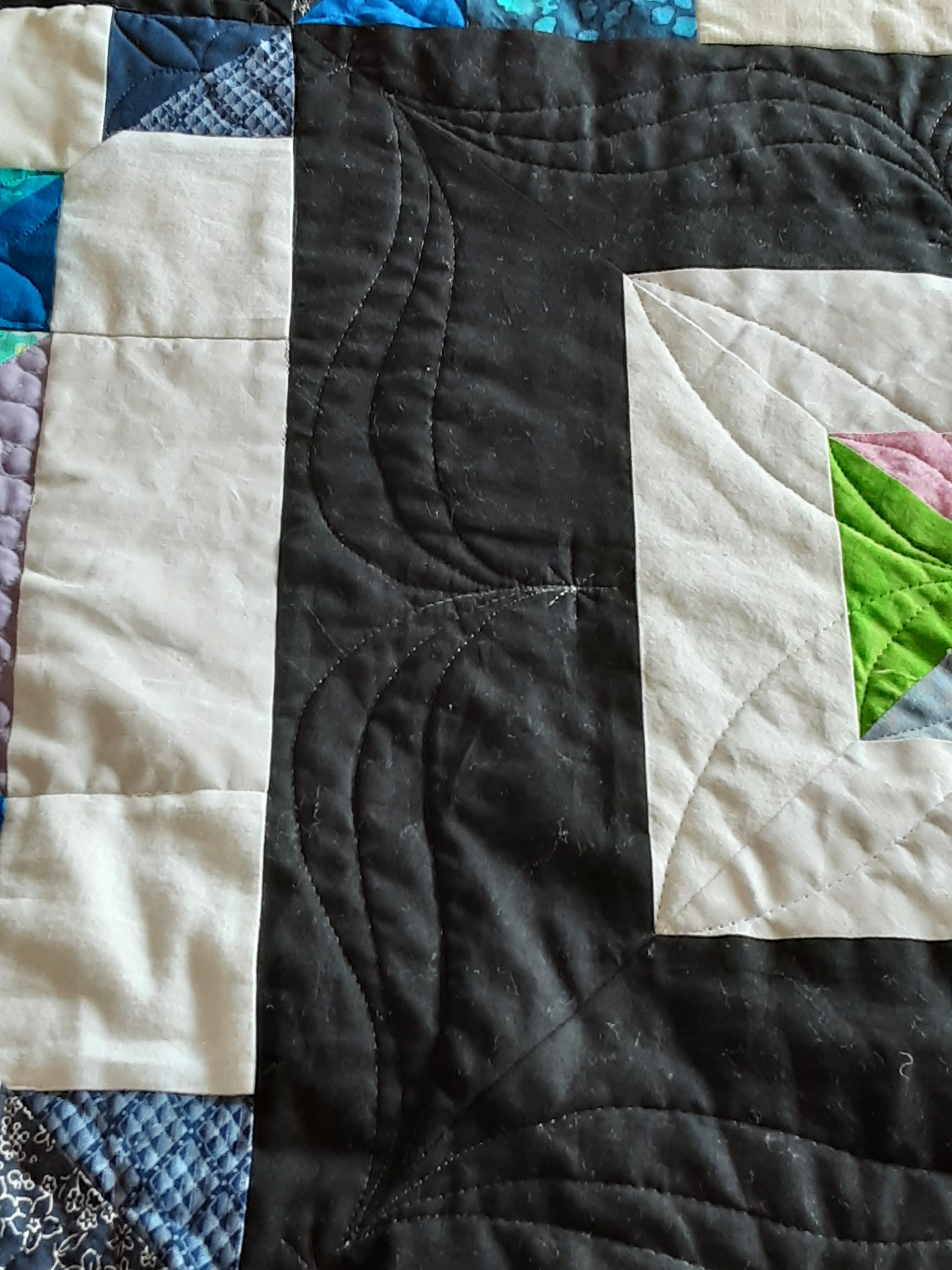 handmade-black-and-white-diamond-quilt-which-measures-approximately-83