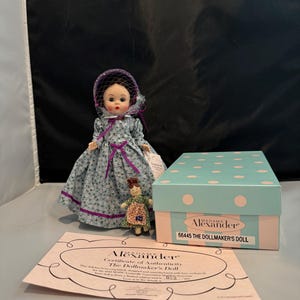 Madame Alexander The Dollmaker’s Doll 66445 with box, accessories, COA and stand.