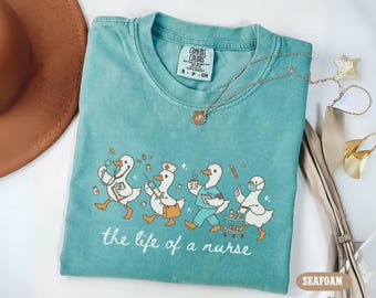 Comfort Colors The Life Of A Nurse Shirt, Silly Goose Nurse Shirt, ER Nurse Tee, Funny Goose Nurse Gift, Nurse Life Crewneck, School Nurse