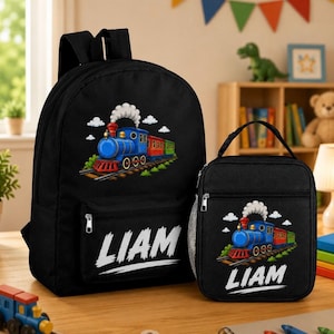 May include: Black backpack and lunch bag set featuring a colorful train illustration. The train is blue, red, and green, with white smoke. The name "LIAM" is printed in white on both items.
