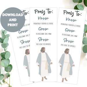 May include: Three white printable bookmarks with a blue illustration of Jesus. The bookmarks have the text "Pray To: Know, Grow, Show" with a description of each word.
