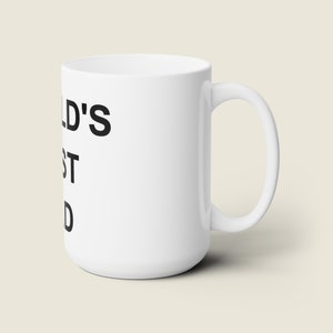 May include: White ceramic mug with black text that reads "World's Best Dad".