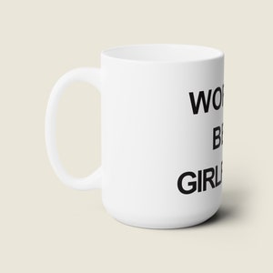 May include: White ceramic mug with black text that reads "World's Best Girl".