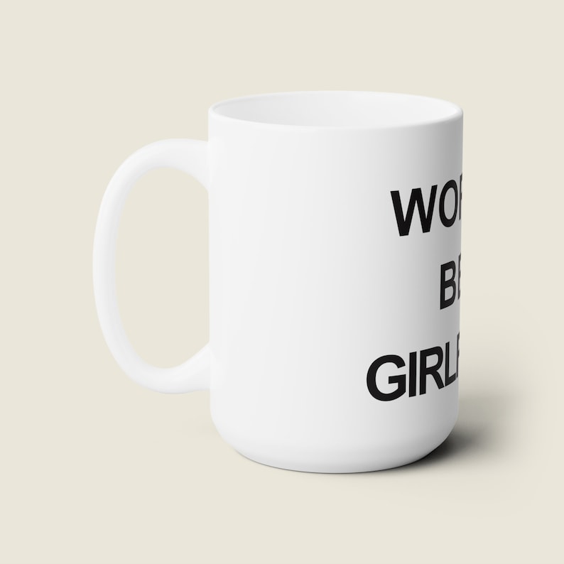 May include: White ceramic mug with black text that reads "World's Best Girl".