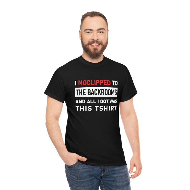 May include: Black t-shirt with white text that reads "I NOCLIPPED TO THE BACKROOMS AND ALL I GOT WAS THIS TSHIRT".