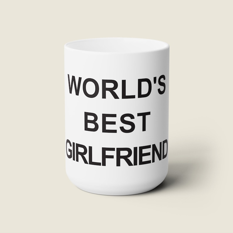 May include: White ceramic mug with black text that reads "WORLD'S BEST GIRLFRIEND".