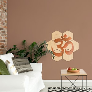 Wooden hexagons birch veneered. Wall tiles with the Om symbol handpainted in copper. Relax, meditate or do yoga with this Om on your wall.