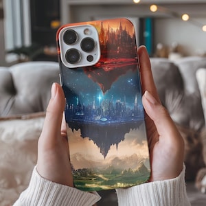 May include: A phone case with a cityscape design. The city is split in half, with the top half showing a fiery sunset and the bottom half showing a starry night sky. The case is made of a hard plastic material and has a glossy finish.
