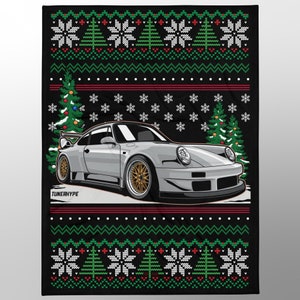 May include: A black blanket with a Christmas sweater design. The blanket features a silver sports car graphic with gold wheels, Christmas trees, snowflakes, and the text "TUNERHYPE". The blanket has a red, green, and white color scheme.