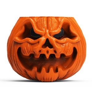 May include: Orange plastic jack-o'-lantern with a carved scary face. The pumpkin has a wide, toothy grin and black eyes.