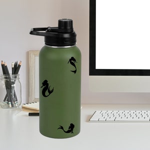 May include: A green stainless steel water bottle with a black lid and handle. The bottle has three black mermaid silhouettes on it.