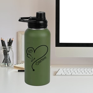 May include: Green stainless steel water bottle with a black lid and handle. The bottle has a black design of a stethoscope in the shape of a heart with the text "RN Lauren" on it.