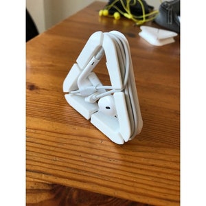 Headphone and cord organizers, earbuds and cables. Many colors