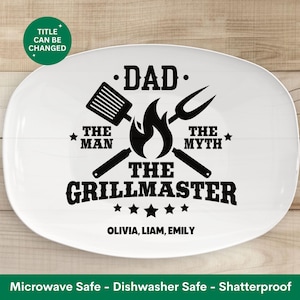 May include: White ceramic serving platter with a black design that reads "Dad - The Man, The Myth, The Grillmaster" with a flame and grill tools. The names Olivia, Liam, and Emily are printed below the design.