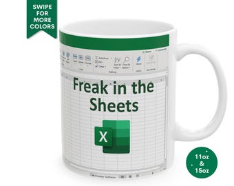 May include: White ceramic mug with a green design featuring a spreadsheet with the text "Freak in the Sheets" and a green "X" in a cell. The mug is available in 11oz and 15oz sizes.